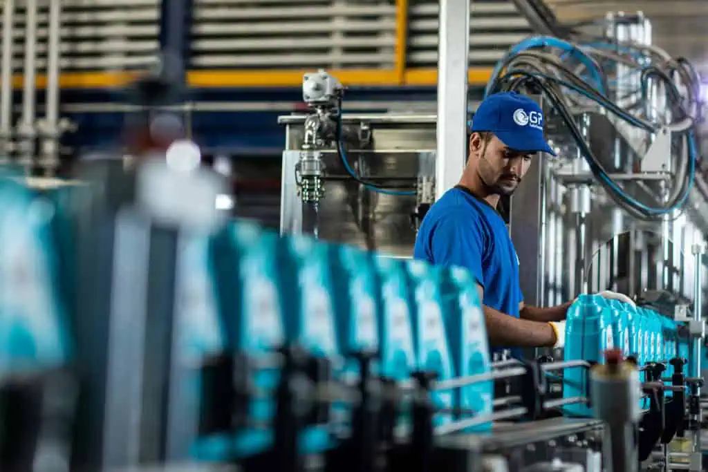Oil & gas industry worker operating machinery in Dubai.