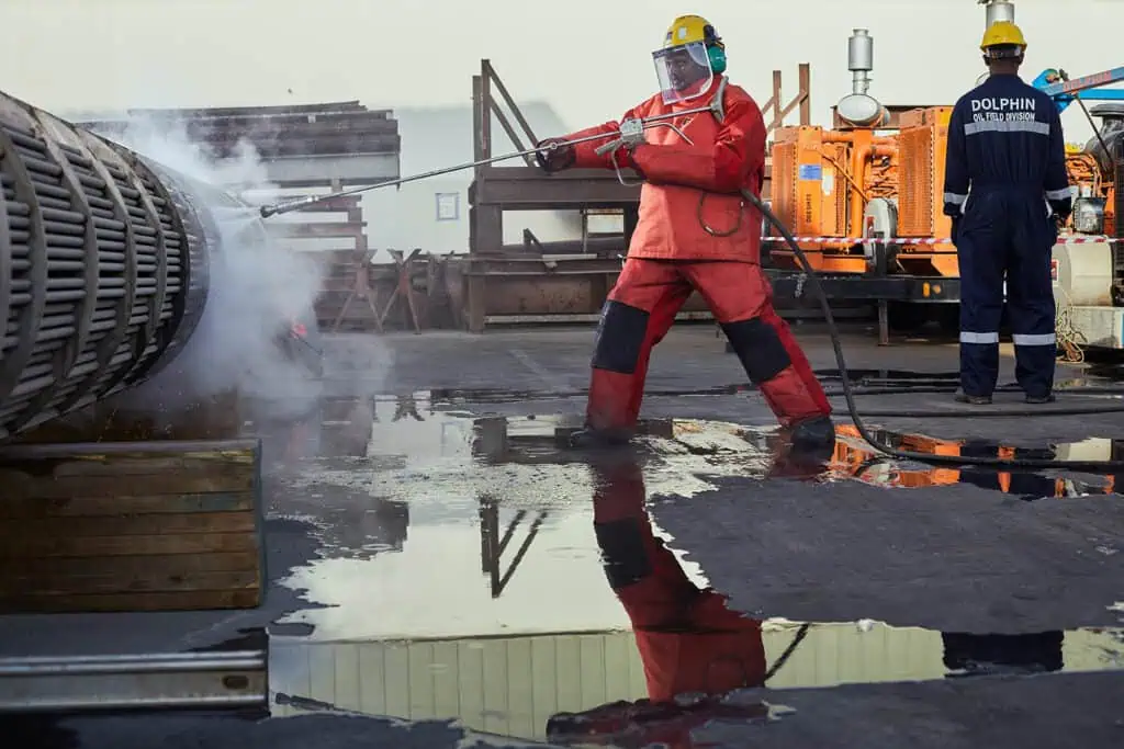 Industrial workers in safety gear working on a construction site in Dubai.