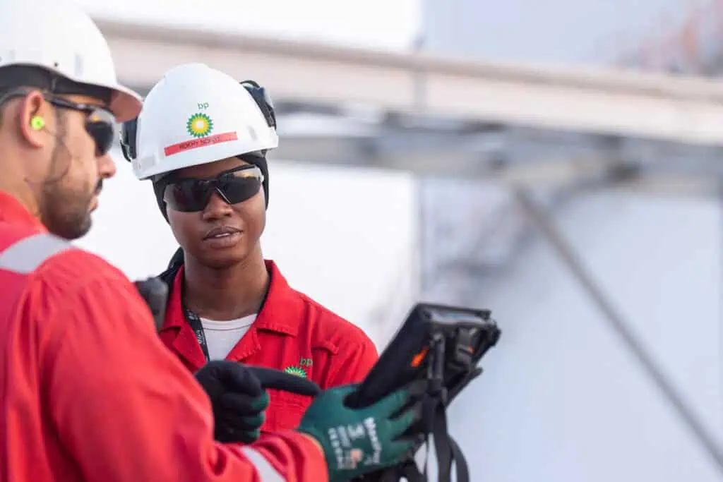 Oil and gas industry professionals using equipment in Oman.