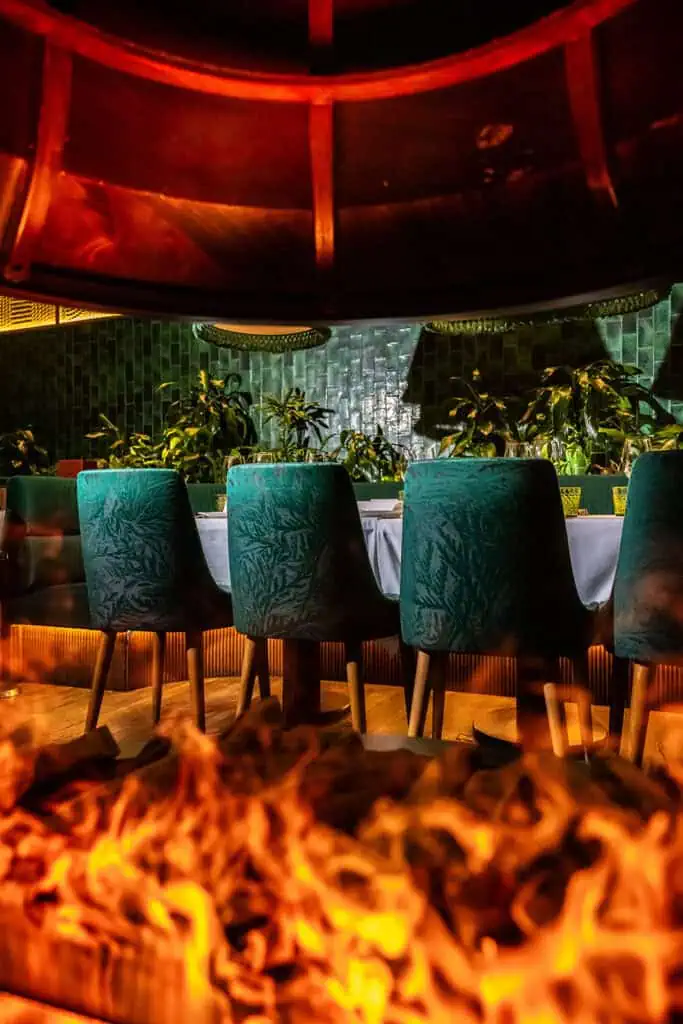 Luxurious Dubai restaurant with modern decor and vibrant lighting.