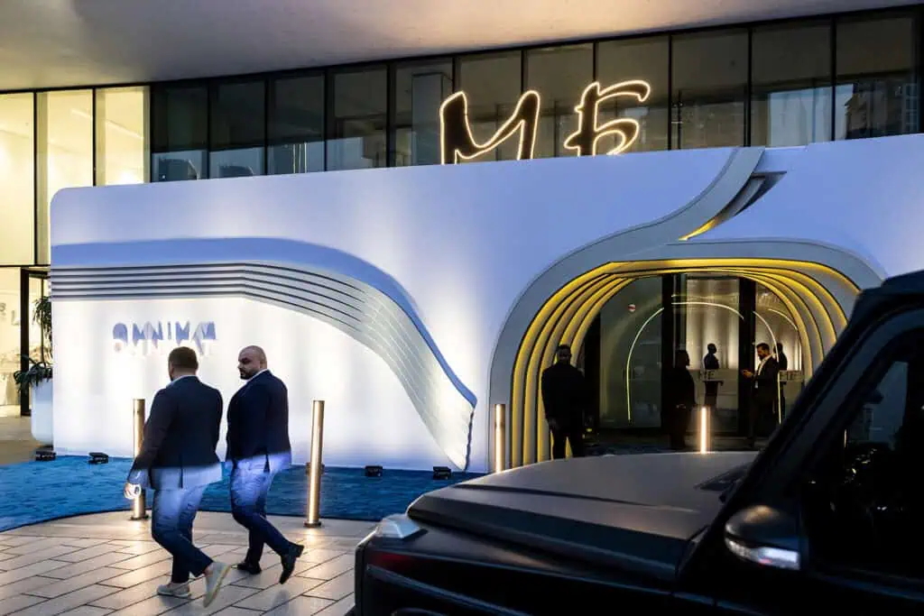 Modern corporate building entrance in Dubai with stylish lighting and design.